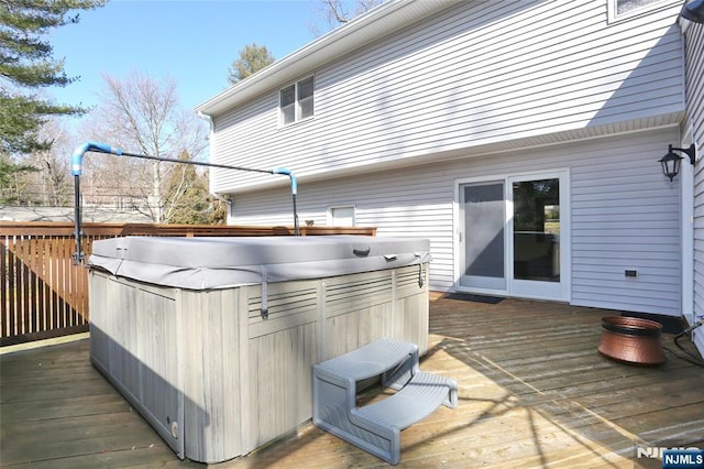 deck featuring a hot tub