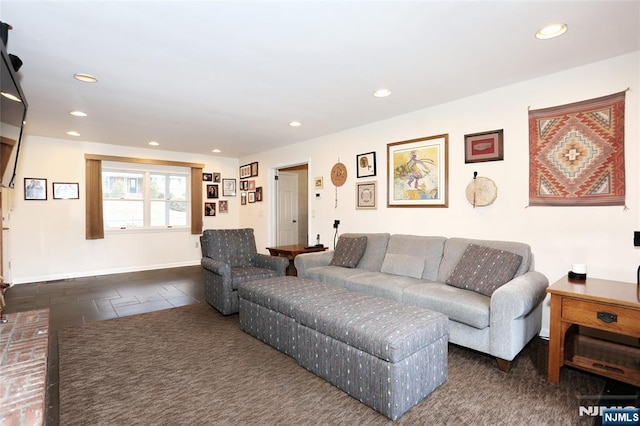 living area with recessed lighting, baseboards, and dark colored carpet