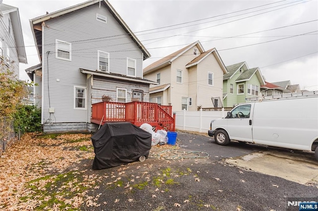 back of property featuring fence