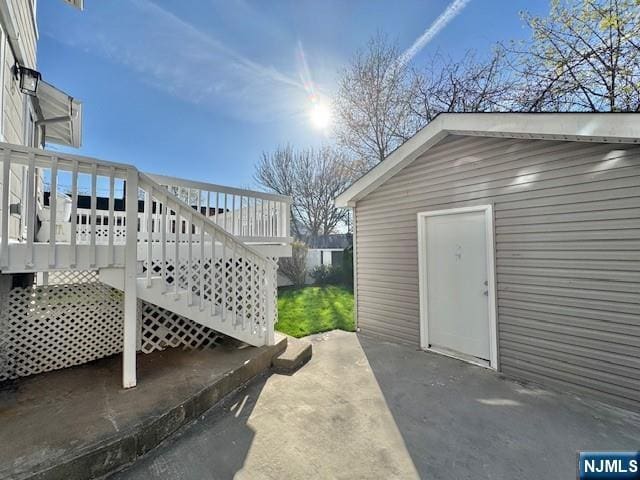 view of patio / terrace with stairs and a wooden deck