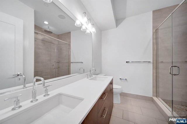 full bathroom featuring a sink, a shower stall, and tile patterned floors