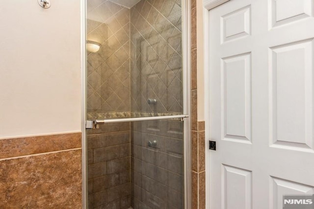 bathroom with a shower stall