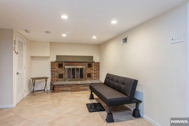 sitting room with baseboards, a fireplace, visible vents, and recessed lighting