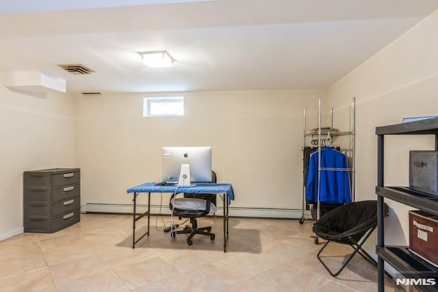 home office with a baseboard radiator and visible vents