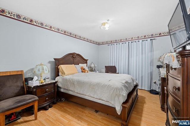 bedroom with light wood-style flooring