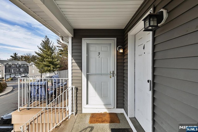 property entrance with a balcony