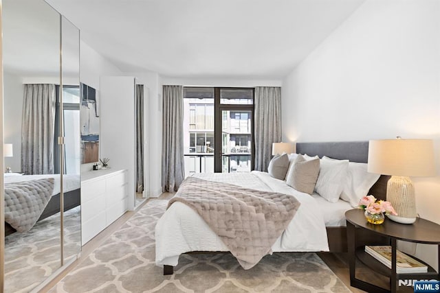 bedroom with a closet and wood finished floors