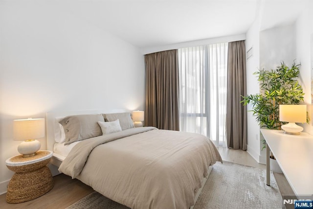 bedroom featuring light wood-style floors