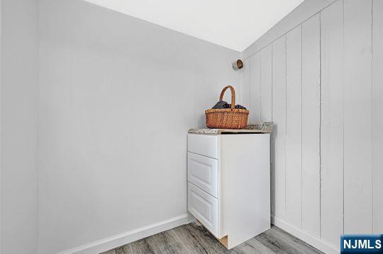 details featuring baseboards and wood finished floors