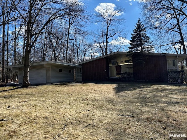 view of side of property with a garage