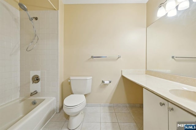 bathroom featuring toilet, bathing tub / shower combination, baseboards, vanity, and tile patterned floors