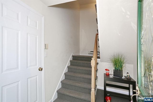 staircase with baseboards