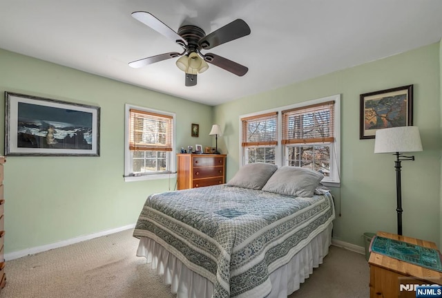 bedroom featuring ceiling fan, carpet, and baseboards