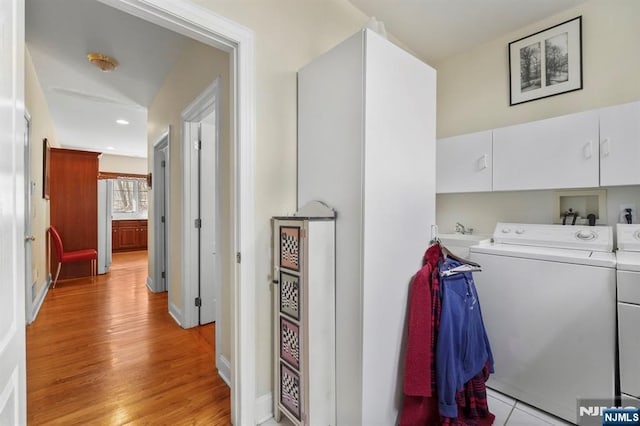 hall with light wood-style flooring, recessed lighting, and washer and clothes dryer