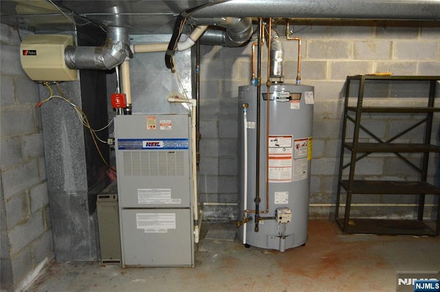 utility room featuring water heater