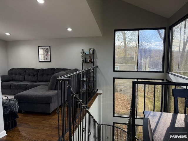 living room featuring recessed lighting, lofted ceiling, and wood finished floors