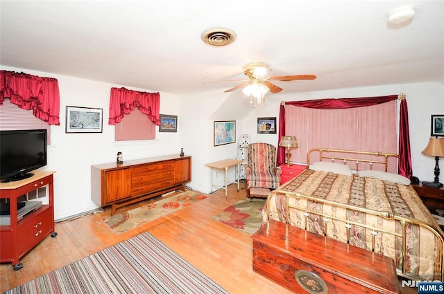 bedroom with light wood-type flooring and visible vents