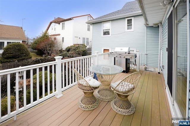 wooden deck with grilling area