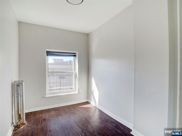 5 Elm St, Newark, NJ 07102 - spare room with wood finished floors and baseboards