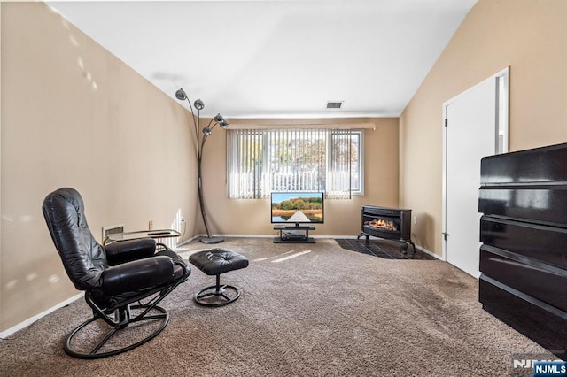 sitting room featuring lofted ceiling, carpet, visible vents, and baseboards