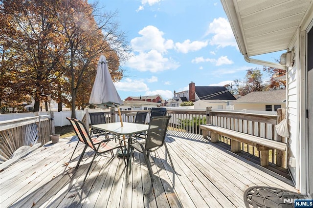 deck featuring outdoor dining area