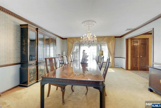 dining area featuring wallpapered walls, an inviting chandelier, and light colored carpet