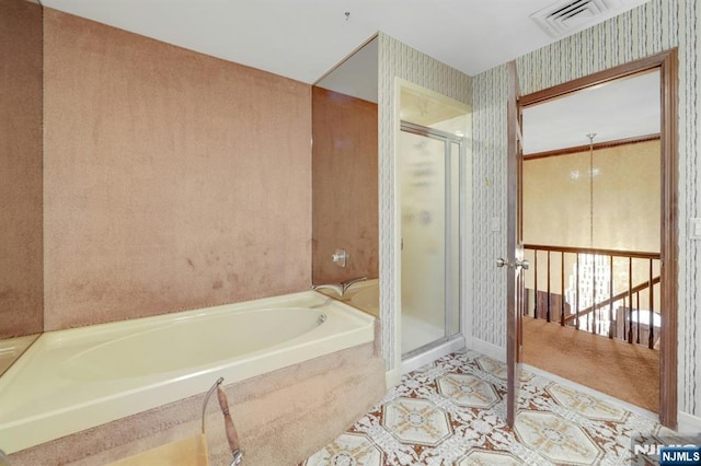 full bath with wallpapered walls, a shower stall, a bath, and visible vents