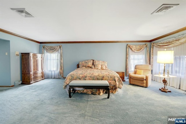 carpeted bedroom featuring visible vents and ornamental molding