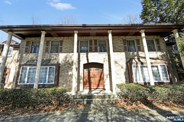 view of front of home with brick siding