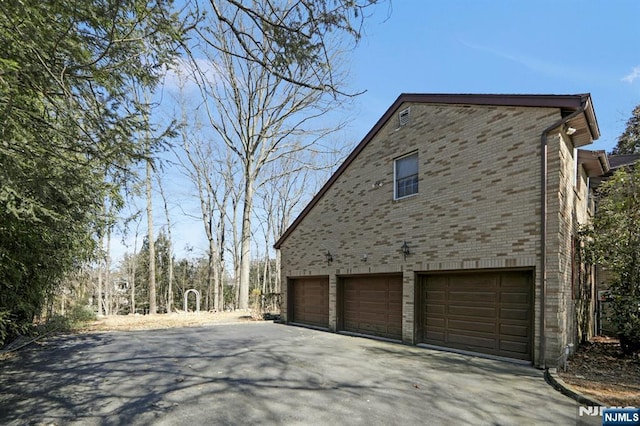 view of property exterior featuring brick siding