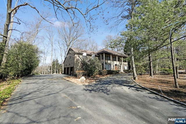 view of front of property with a garage and driveway