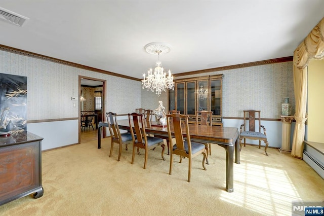 dining area featuring visible vents, a chandelier, crown molding, and wallpapered walls