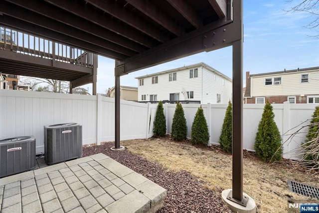 view of patio featuring central AC and a fenced backyard