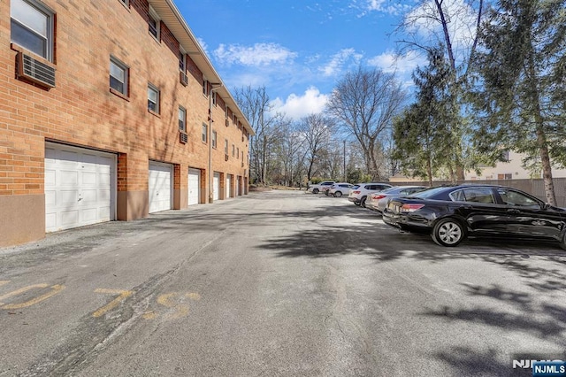 view of road with community garages