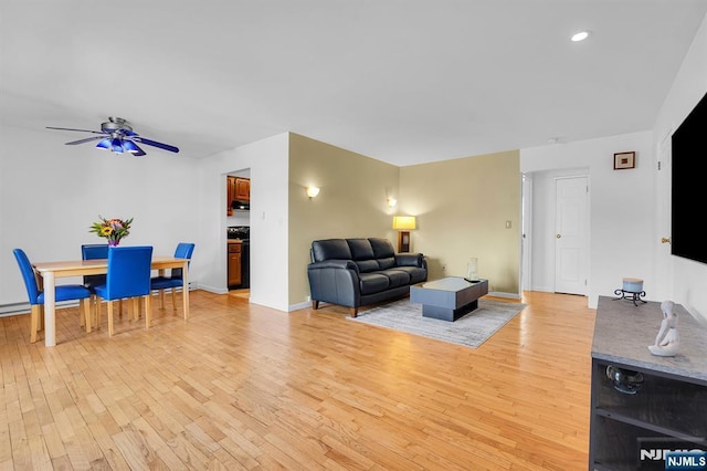 living room with recessed lighting, baseboards, ceiling fan, and light wood finished floors