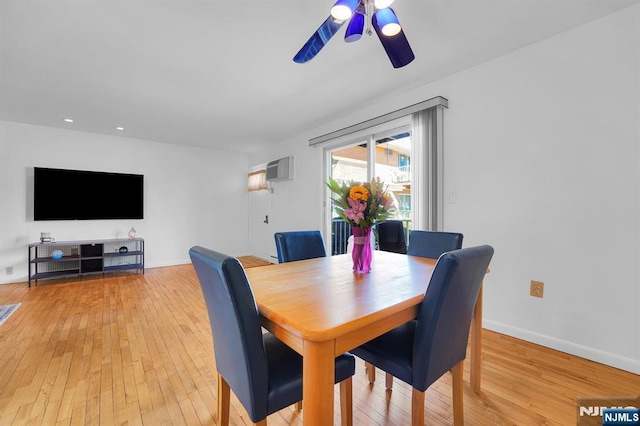 dining room featuring light wood finished floors, recessed lighting, ceiling fan, a wall mounted air conditioner, and baseboards