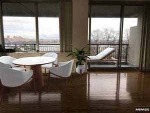 dining area featuring a wealth of natural light and wood finished floors