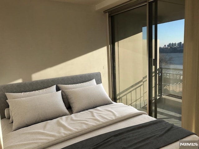 bedroom featuring a view of city