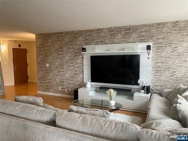 living room featuring parquet floors and a textured ceiling