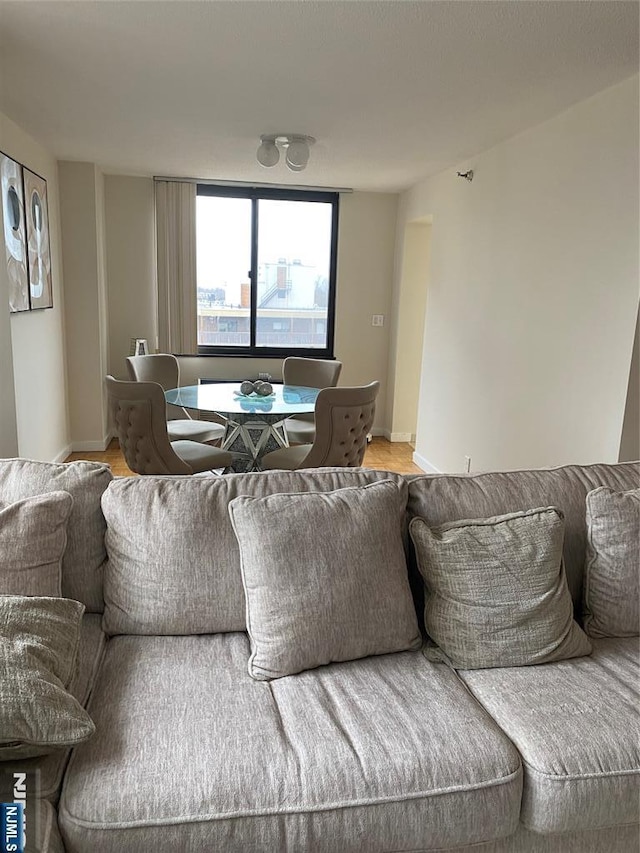 living room featuring baseboards