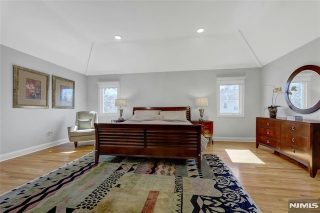 bedroom with recessed lighting, baseboards, lofted ceiling, and wood finished floors