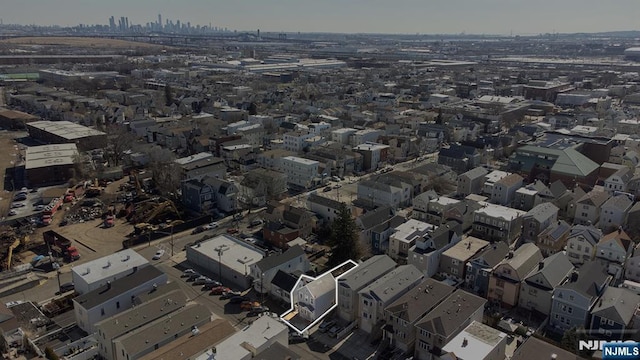 birds eye view of property featuring a city view