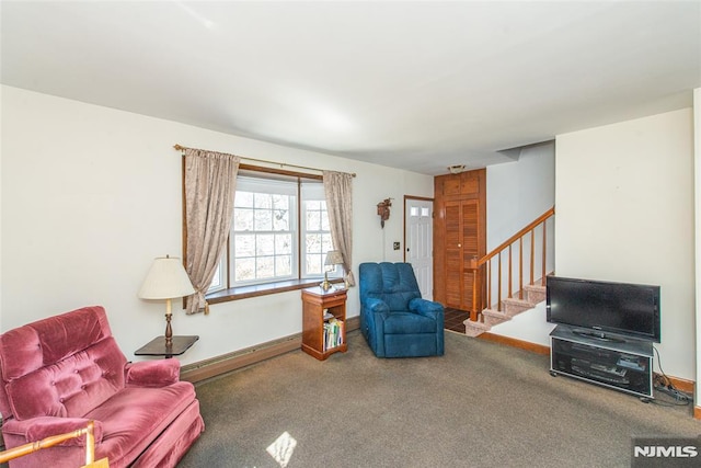 living room with stairway, a baseboard heating unit, baseboards, and carpet floors