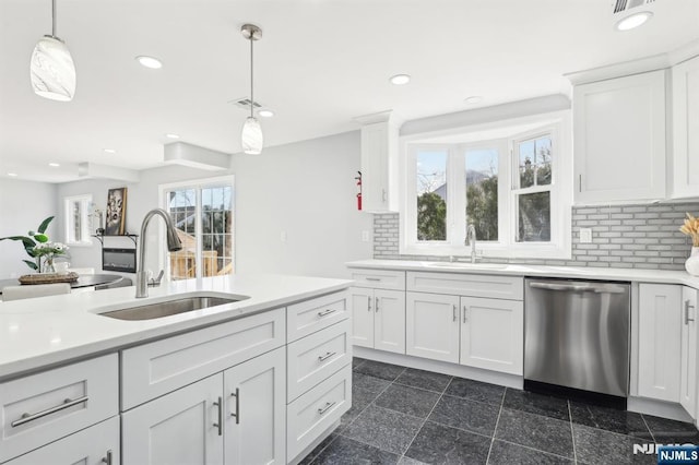 kitchen with granite finish floor, recessed lighting, dishwasher, and a sink