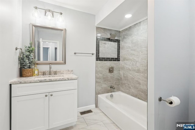 bathroom with visible vents, marble finish floor, washtub / shower combination, baseboards, and vanity