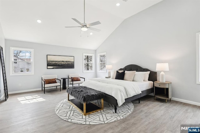 bedroom featuring recessed lighting, high vaulted ceiling, baseboards, and wood finished floors