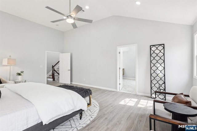 bedroom featuring recessed lighting, baseboards, lofted ceiling, and light wood finished floors