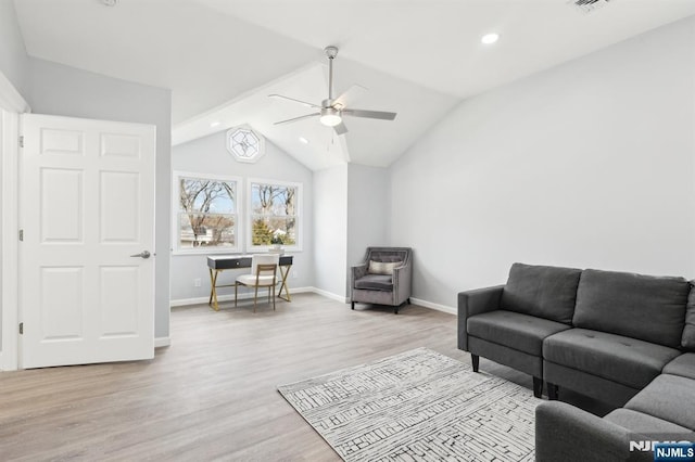 living room featuring lofted ceiling, a ceiling fan, recessed lighting, light wood-style floors, and baseboards