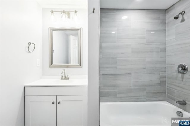 bathroom with shower / bath combination and vanity