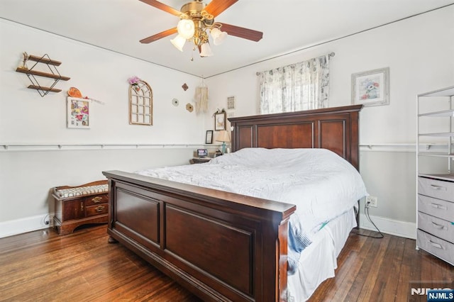 bedroom featuring a ceiling fan, dark wood-type flooring, and baseboards